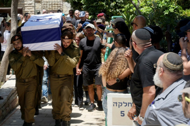 Israeli soldiers carry the coffin of a colleague killed on Thursday in Gaza, where at least 312 Israeli soldiers have been killed