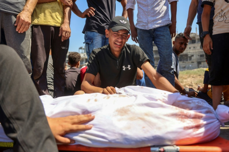 Relatives mourn loved ones killed during Israeli bombardment in the al-Tuffah neighbourhood in Gaza City on June 22, 2024