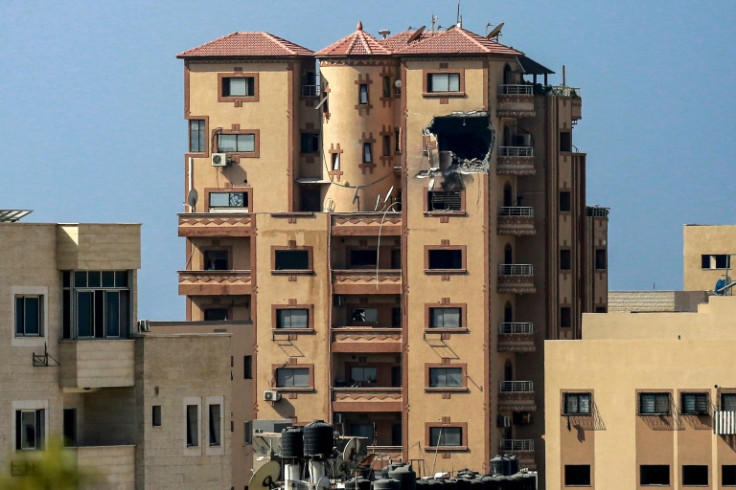 A gaping hole is shown on November 3, 2023 in the Hajji building which houses Agence France Presse (AFP) news bureau in Gaza City, amid the ongoing battles between Israel and the Palestinian group Hamas