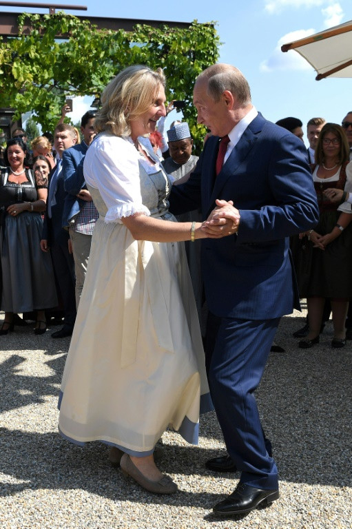 Widely circulated photos of Karin Kneissl's dance with Russian President Vladimir Putin made headlines, while raising questions of Austria's neutrality