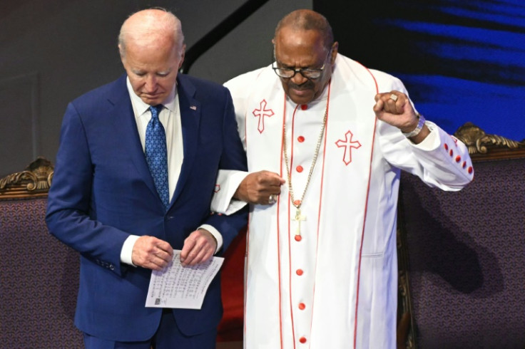 US President Joe Biden stands with Bishop Ernest Morris Sr during a church service and campaign event at Mount Airy Church of God in Christ in Philadelphia, Pennsylvania, on July 7, 2024