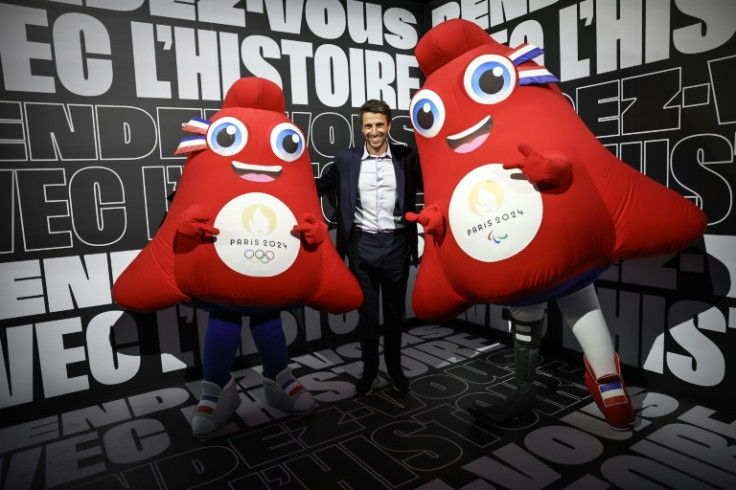 Chief Paris 2024 organiser Tony Estanguet, seen here with mascots, has tried to stay upbeat