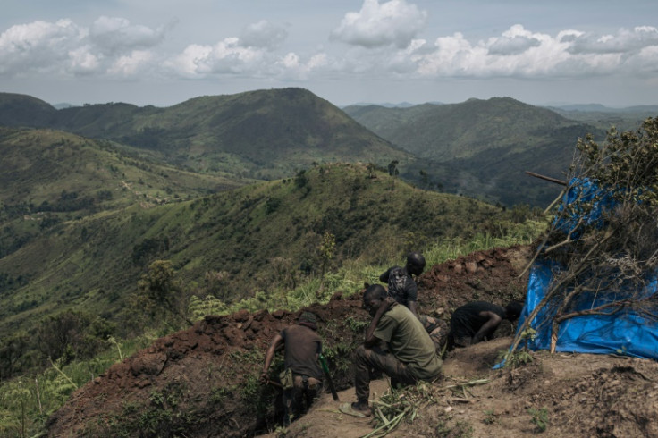 DR Congo soldiers dig trenches in May at a frontline military position above the town of Kibirizi controlled by M23 rebels in North Kivu province