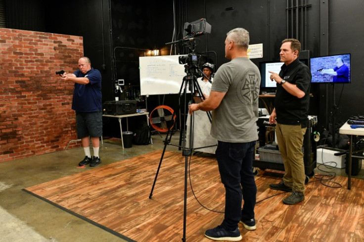 A group of filmmakers attend a training course run by Dutch Merrick, a veteran Hollywood armorer