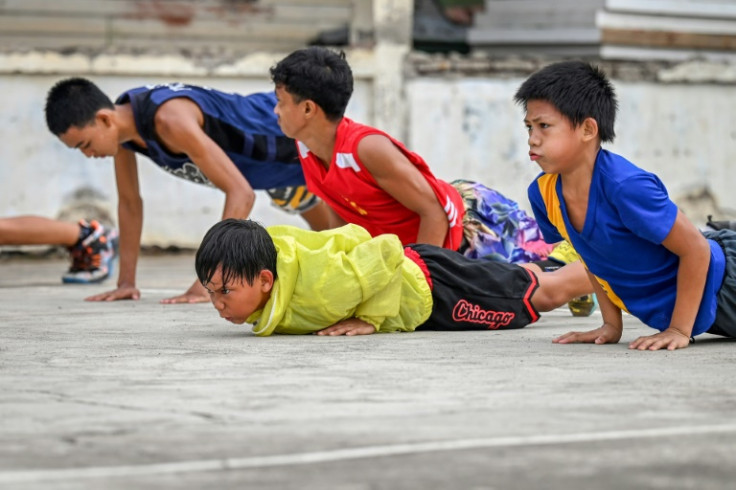 Young boxers perform their morning exercises at Manuel Torres Sports Center in Bago City, Negros Occidental province