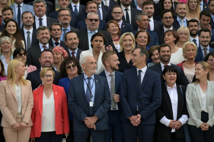 Marine Le Pen led her bolstered far-right troops on a visit to their future workplace