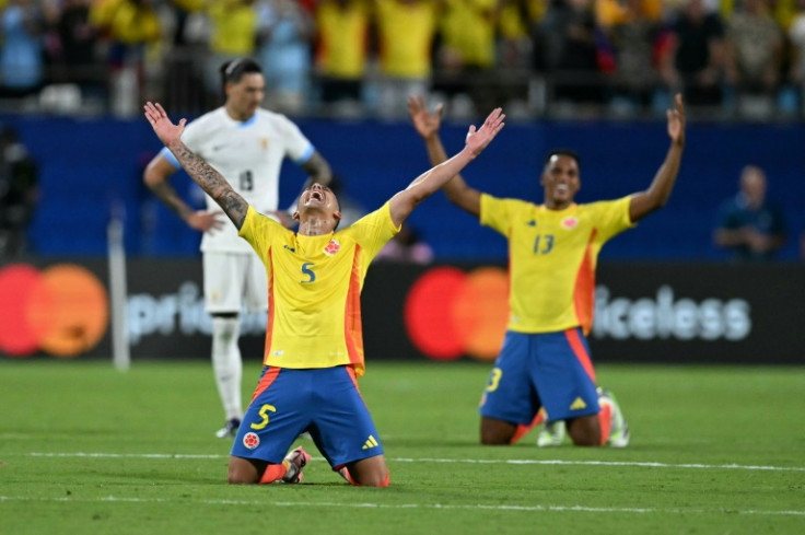 Colombia midfielder Kevin Castano team-mate Yerry Mina celebrate their team's semi-final victory over Uruguay in the Copa America