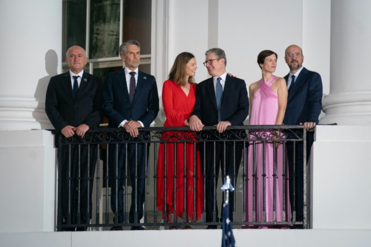 Starmer and his wife Victoria (in red) posed with NATO leaders on the White House balcony
