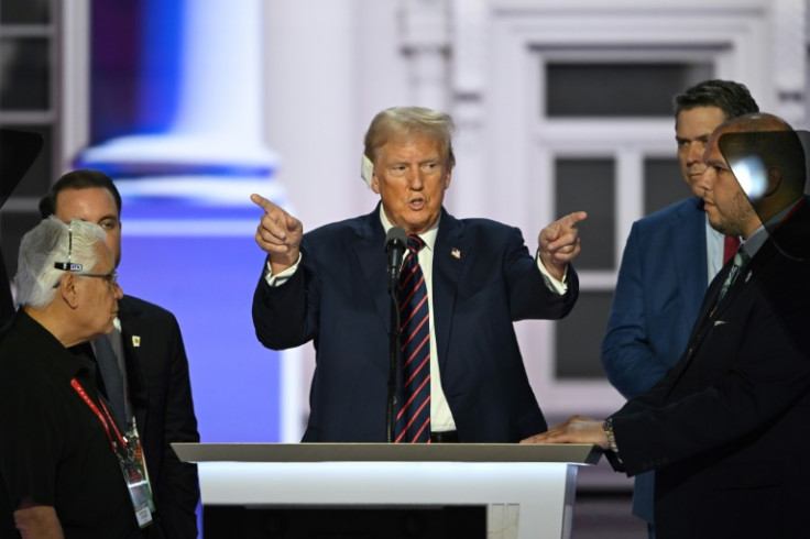 Donald Trump stands at the lectern during a sound check on the third day of the 2024 Republican National Convention