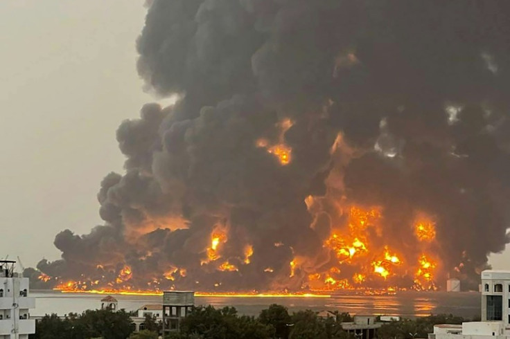 A picture released by the Huthis shows flames and smoke rising over the rebel-held Yemeni port of Hodeida after an Israeli strike