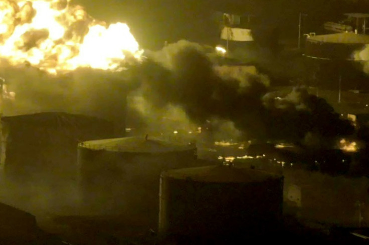 Another picture released by Yemen's Huthis shows a fire blazing near fuel tanks in Hodeida port after Israel's retaliatory air strikes against the Iran-backed rebels