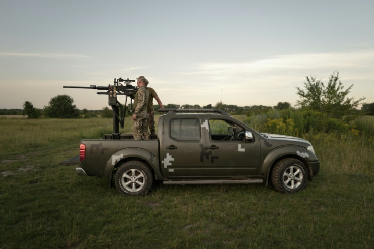 The town's lights are turned off at night and the troops scour the sky, ready to shoot down drones with machine guns