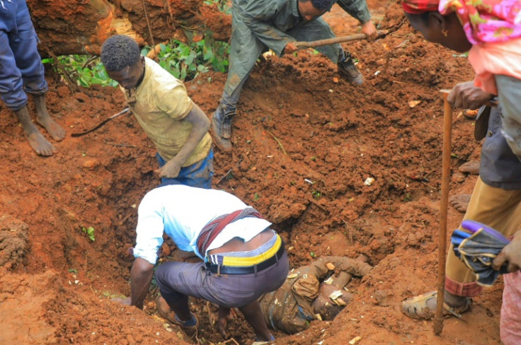 Local residents have been using shovels and their bare hands to dig through the vast mounds of mud