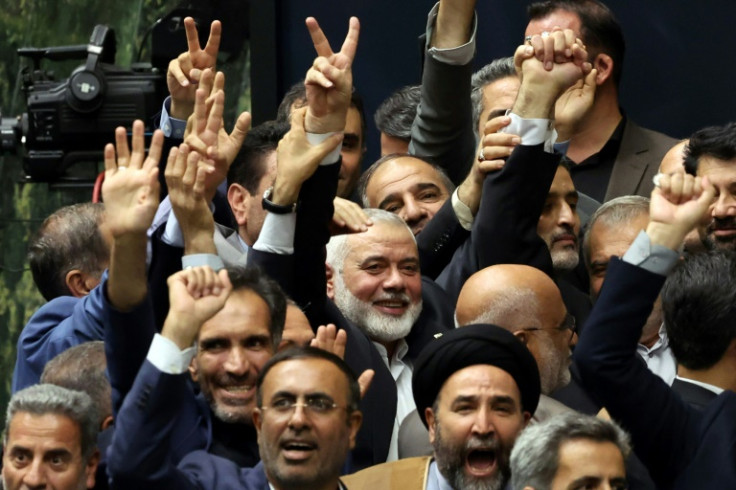 Speculation is swirling over the crucial succession in Hamas after the killing of its political chief Ismail Haniyeh, pictured in the centre the day before his death