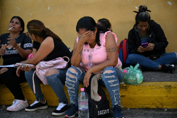 Relatives of people arrested during Venezuela's post-election protests wait for news outside of the Bolivarian National Police (PNB) Detention Centre