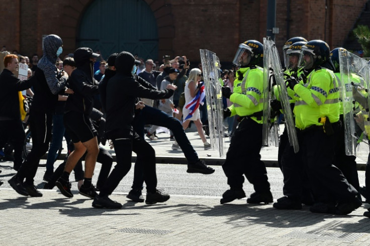 Police also had to deal with protesters in Liverpool in the northwest