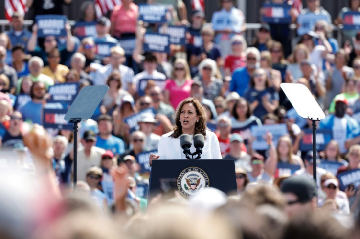 Kamala Harris addresses a large outdoor campaign rally in Eau Claire, Wisconsin, where supporters stood for hours in long lines to enter the venue