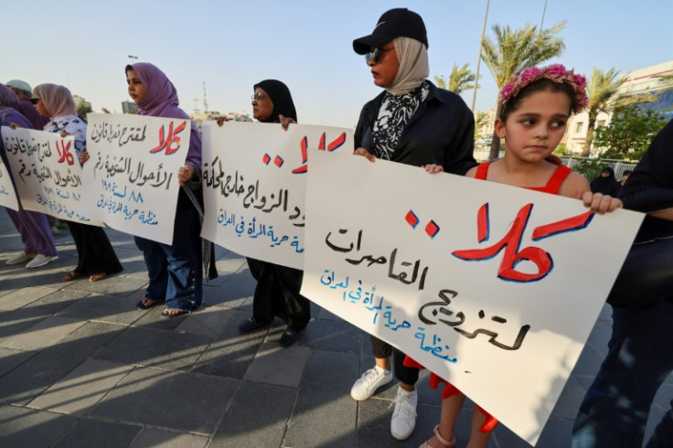 Activists in Baghdad's Tahrir Square demonstrate against female child marriage on July 28, 2024