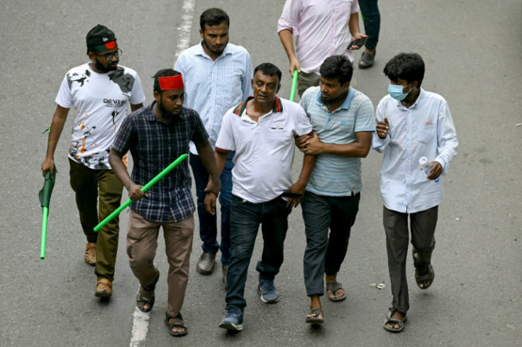 Several people the crowd suspected of being Awami League supporters were thrashed with sticks, while others were forcibly escorted away