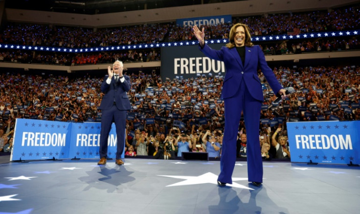 Kamala Harris and Tim Walz arrive to speak during a campaign rally in Milwaukee, Wisconsin, August 20, 2024