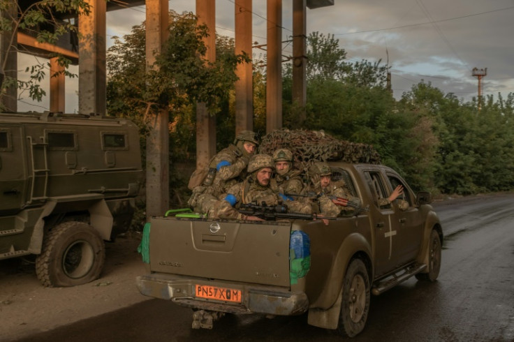 Ukrainian soldiers in a vehicle in an undisclosed area of the eastern Donetsk region