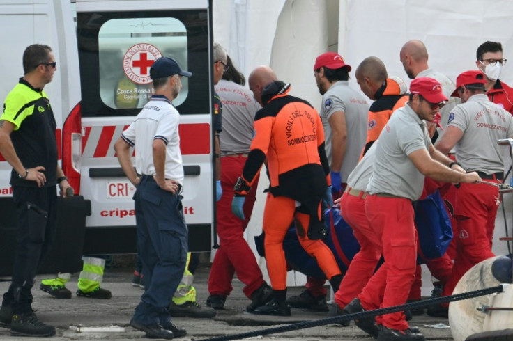 Specialist divers were still looking for a missing woman, a coastguard official told AFP