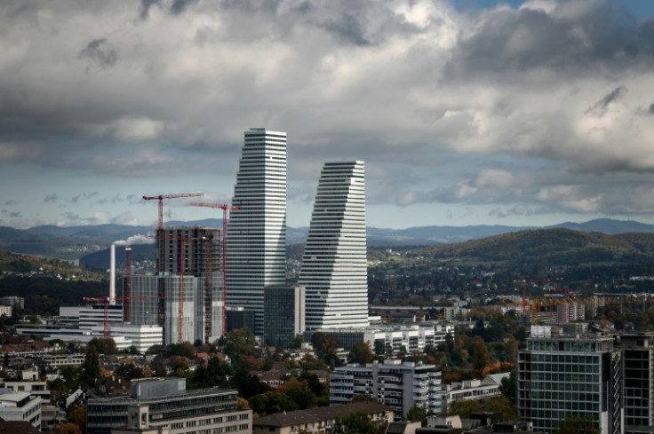 The towers of Swiss pharmaceuticals giant Roche's headquarters, and the city's minster, dominate the Basel skyline