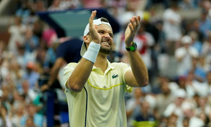 Back in the last eight: Grigor Dimitrov celebrates after defeating Andrey Rublev