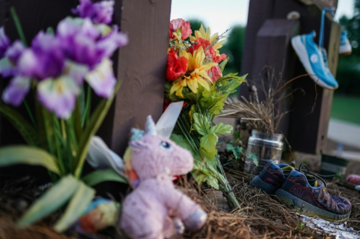 Along the edge of Lake Herrick in Athens, Georgia is a makeshift memorial to Laken Riley, a 22-year-old student who was murdered while out for a morning jog