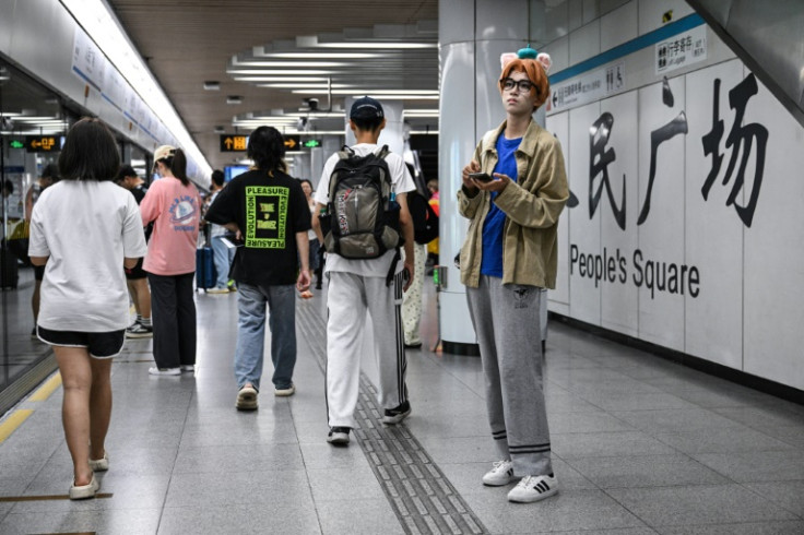 Feng was waiting for Xu at a metro station, and grinned in unabashed delight when she spotted her