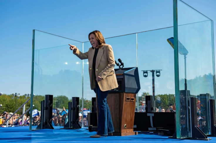 US vice president and Democratic 2024 presidential nominee Kamala Harris speaks behind protective glass as she addresses a rally at the Throwback Brewery in North Hampton, New Hampshire