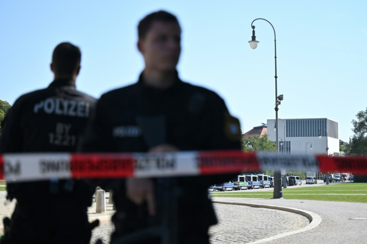 Police officers secure the area of the shootout