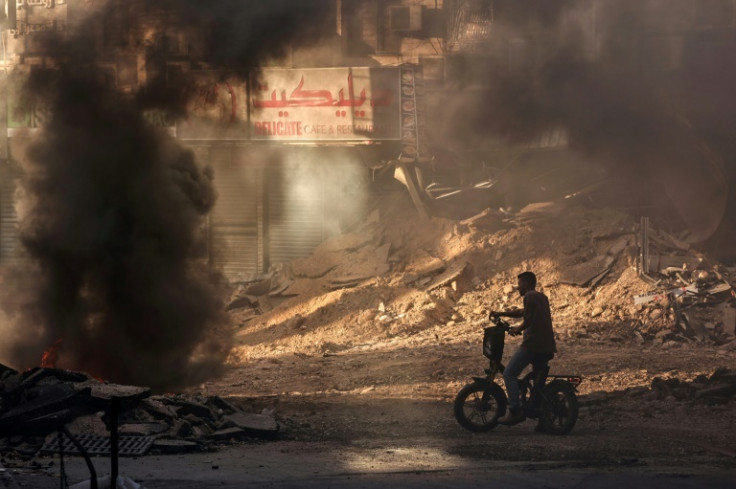 A devastated street in Jenin, with tyres set ablaze by youths during the Israeli raid