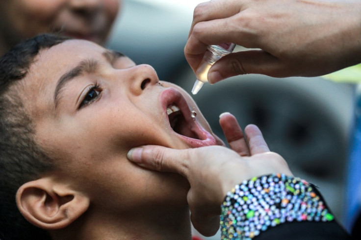 A child receives vaccination for polio in Khan Yunis in the southern Gaza Strip