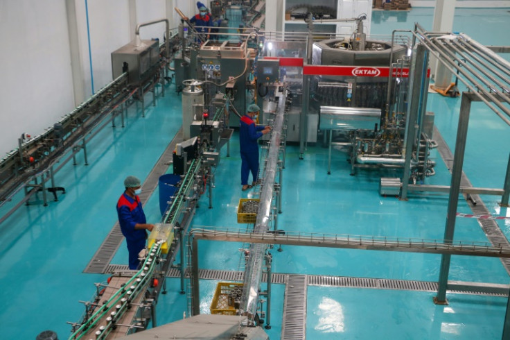 In the industrial hub of western Herat, the Pamir Cola company says it produces over a million cans daily