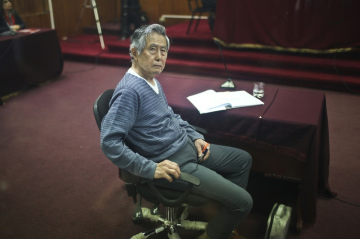 (FILES) Peru's former president (1990-2000), Alberto Fujimori, who faces trial appears in court for a hearing in Lima, on November 07, 2013. He died on Wednesday at the age of 86 in Lima