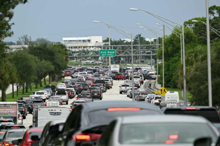 Cars are stuck in traffic after police blocked the road in West Palm Beach, Florida, on September 15, 2024 following a shooting incident at former US president Donald Trump's golf course