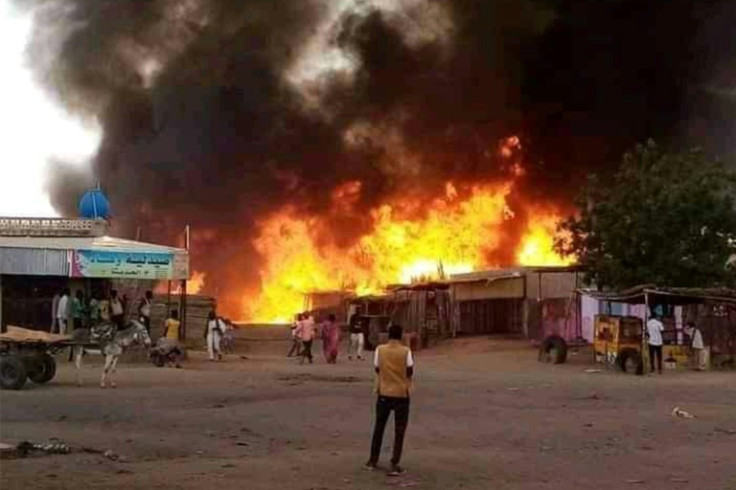 Fire rages in a livestock market area of El-Fasher, North Darfur, on September 1, 2023, as Sudan's war spread to the city