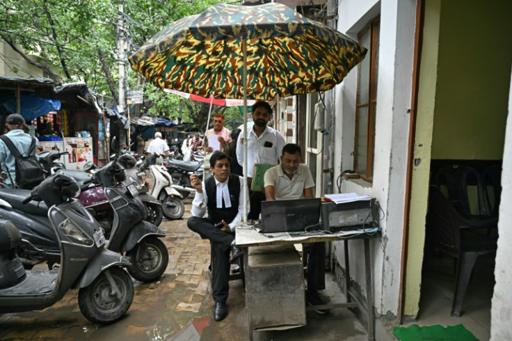 A man drafts a legal document outside the court in Ghaziabad. India's judicial jam could take decades -- if not centuries -- to clear, even without a pileup of fresh cases