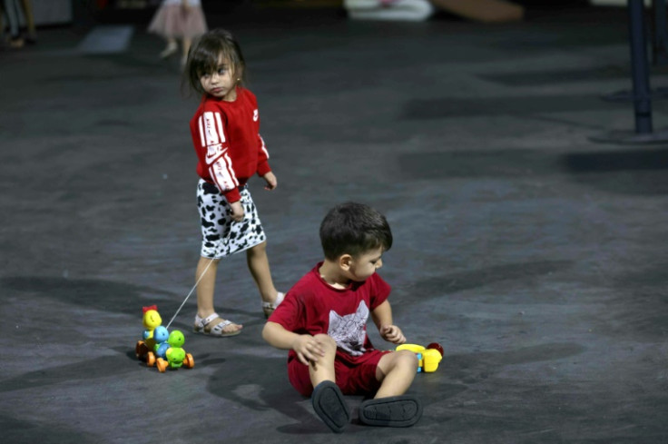 Displaced children have turned the venue's dancefloor into a makeshift play area