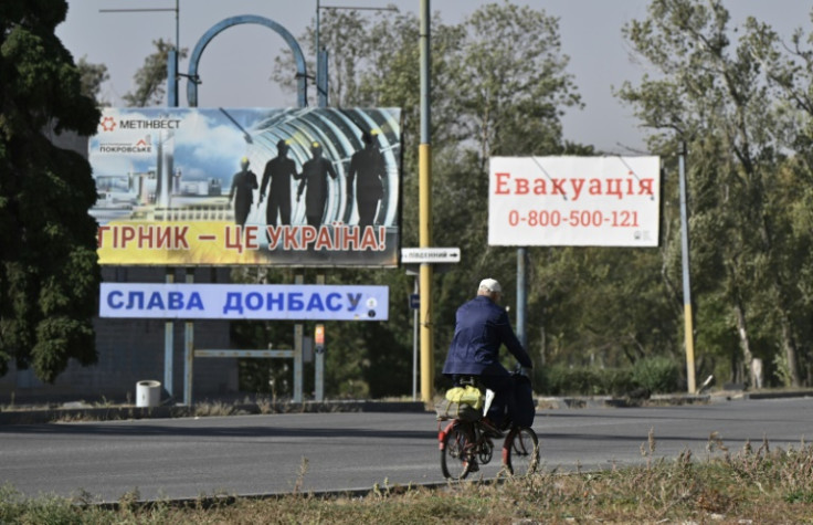 In Pokrovsk, posters hailing Ukraine's miners stood next to advice to people evacuating