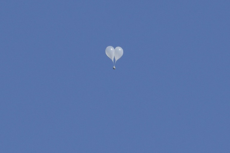 AFP reporters saw yet more balloons carrying bags of trash from North Korea over Seoul on Friday