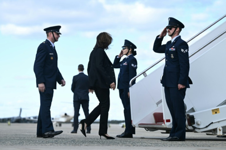 US Vice President and Democratic presidential candidate Kamala Harris (C) is headed to Erie, Pennsylvania, for a campaign event.