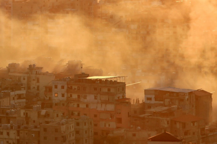Smoke rises over a neighbourhood of Beirut's southern suburbs following an Israeli air strike on October 19
