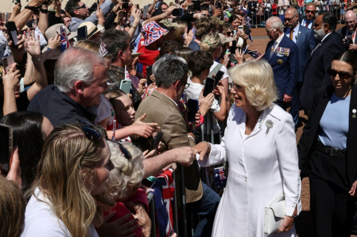 Britain's Queen Camilla (front) and King Charles III greet members of the public outside Parliament House in Canberra on October 21, 2024, during a six-day royal visit to Sydney and Canberra