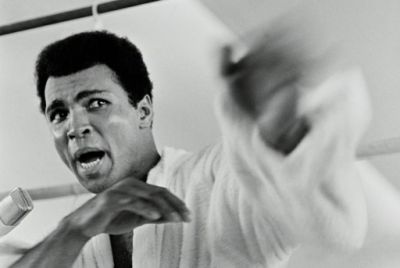 Muhammad Ali playing to the cameras at a press conference three days before The Rumble in the Jungle
