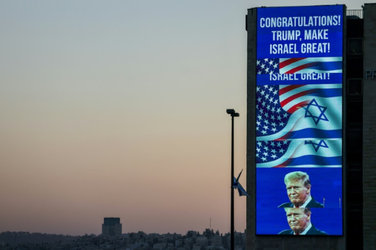 A large billboard congratulating Republican candidate Donald Trump in the US presidential election is lit on the side of a building in Jerusalem