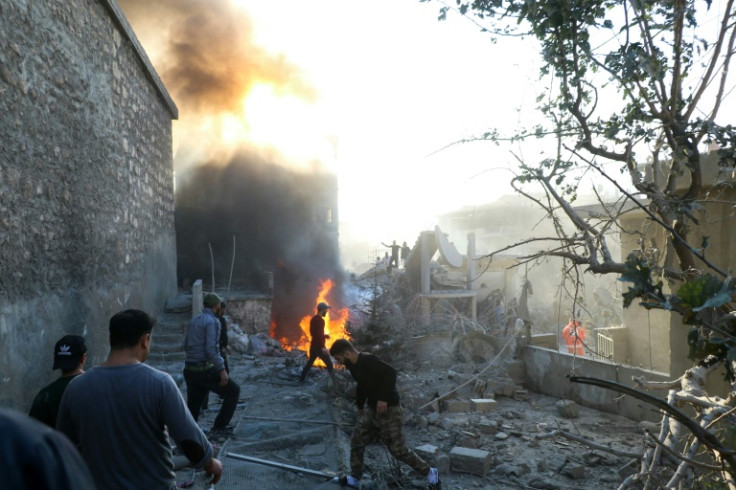 Residents and rescuers comb through rubble in Lebanon's eastern city of Baalbek after deadly Israeli strikes
