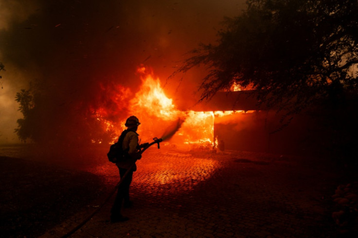 The fast-moving fire near Los Angeles has forced thousands from their homes and destroyed dozens of properties
