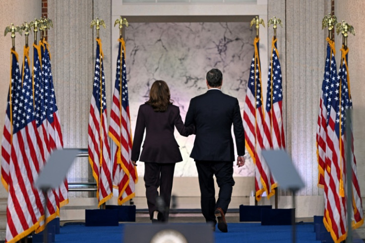 US Vice President Kamala Harris and her husband Second Gentleman Doug Emhoff leave after she gave a speech conceding the 2024 presidential election to Donald Trump